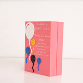 Angled side view of birthday girl’s acrylic gift box