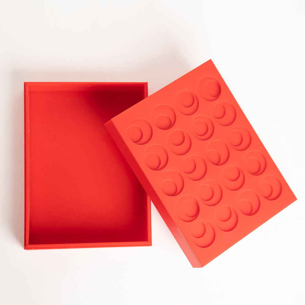 Open view of reusable red acrylic box with layered design