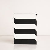 Front view of black and white striped acrylic gift box