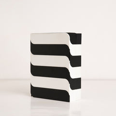 Angled view of modern black and white horizontal pattern gift box