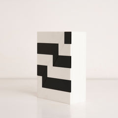 Side angle showing modern striped pattern on reusable acrylic gift box