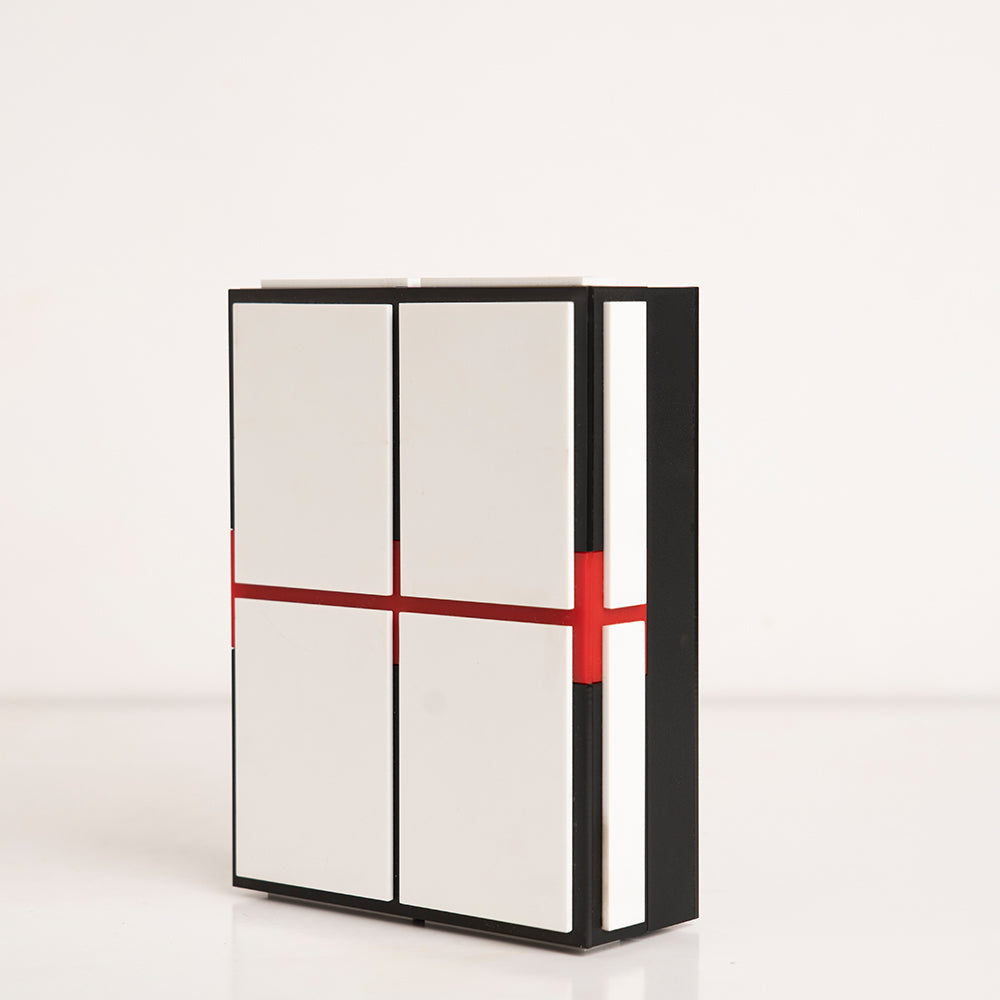 Angled view showing layered design of red, black, and white acrylic gift box