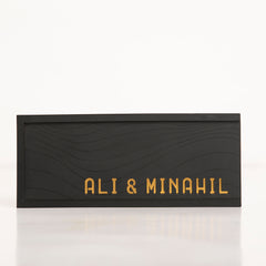 Front of the Black Salami Gift Box with elegant gold writing on matte black finish