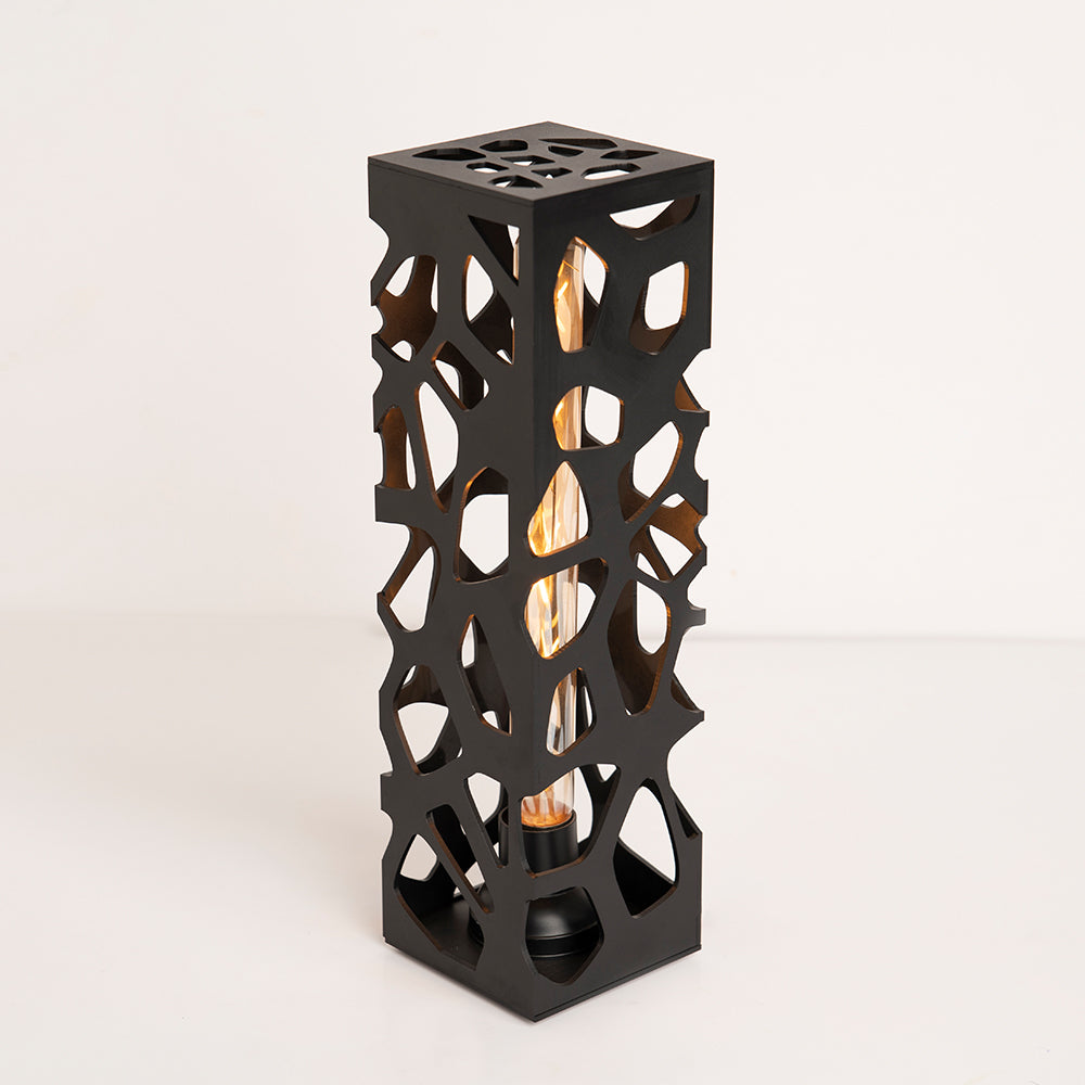 Side angle revealing base details and lamp silhouette