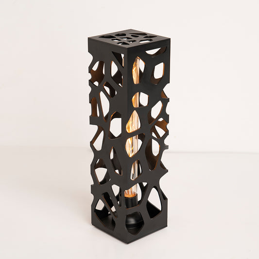 Side angle revealing base details and lamp silhouette