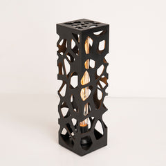 Side angle revealing base details and lamp silhouette