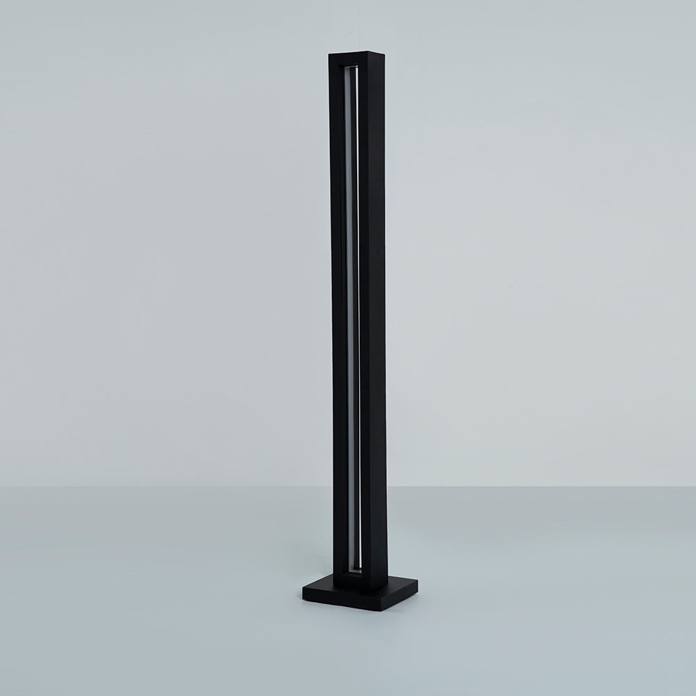 Angled shot highlighting the lamp’s tall structure and glow