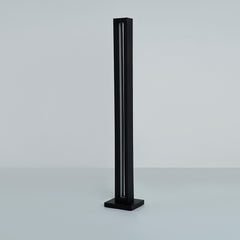 Angled shot highlighting the lamp’s tall structure and glow