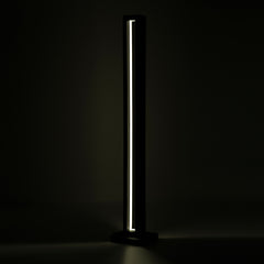 Angled shot highlighting the lamp’s tall structure and glow