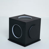 Angled view showing depth and structure of the cubic lamp