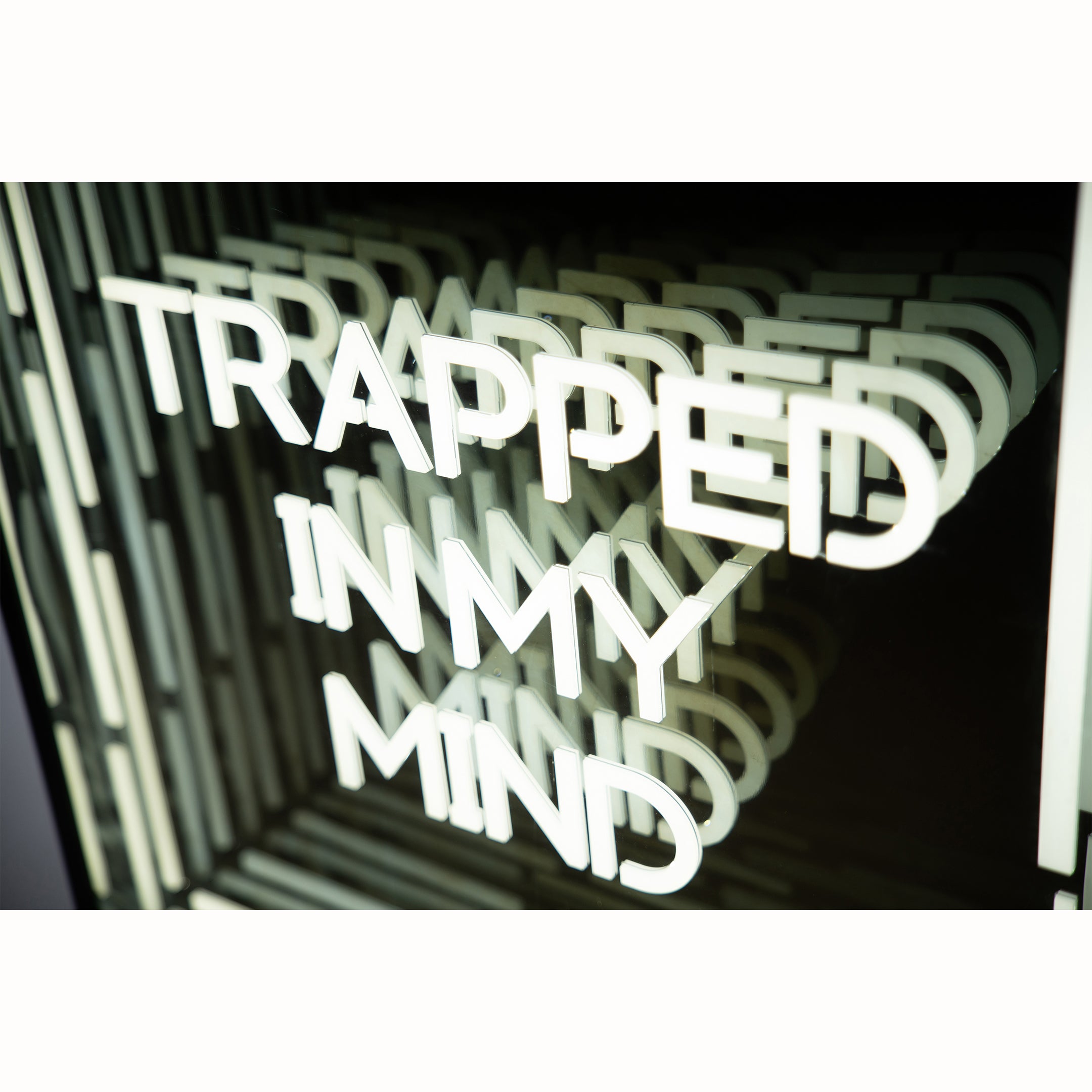Front shot of Trapped In My Mind Infinity Mirror with deep glowing tunnel