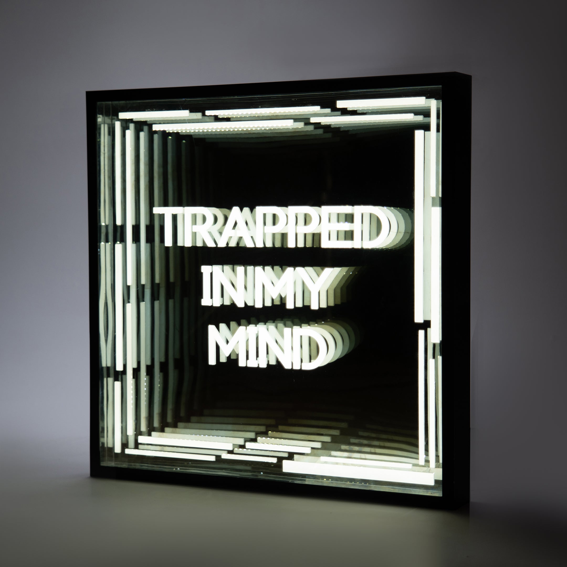 Front shot of Trapped In My Mind Infinity Mirror with deep glowing tunnel