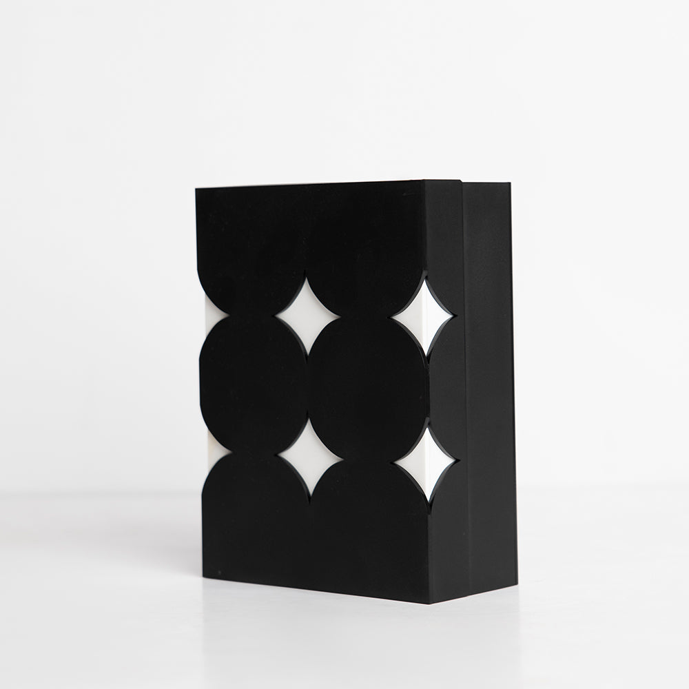 Angled side view of playful star-shaped clear acrylic box