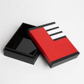 Open view of triple-layered acrylic gift box with stripes