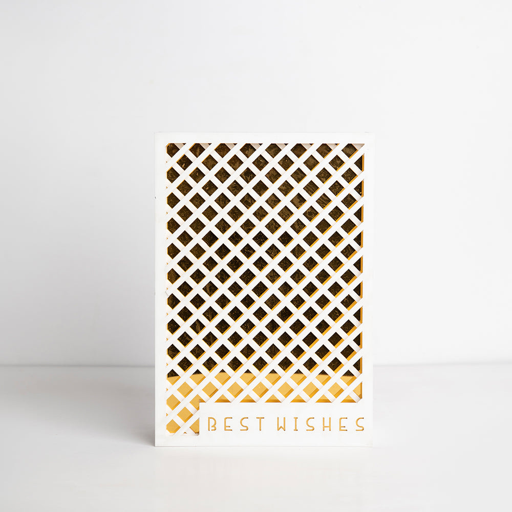 Front view of black and white acrylic gift box with gold square and “Best Wishes” engraving