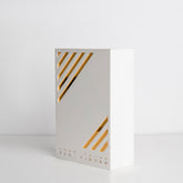 Angled view showing elegant gold accents on white box