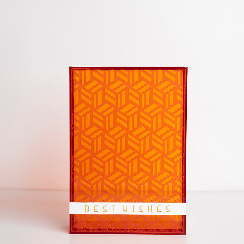 Front view of orange transparent acrylic gift box with “Best Wishes” engraving