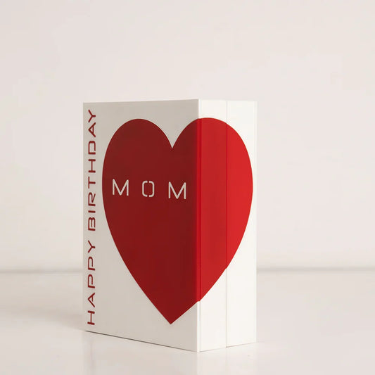 Front view of white acrylic birthday gift box with large red heart and the word "MOM"