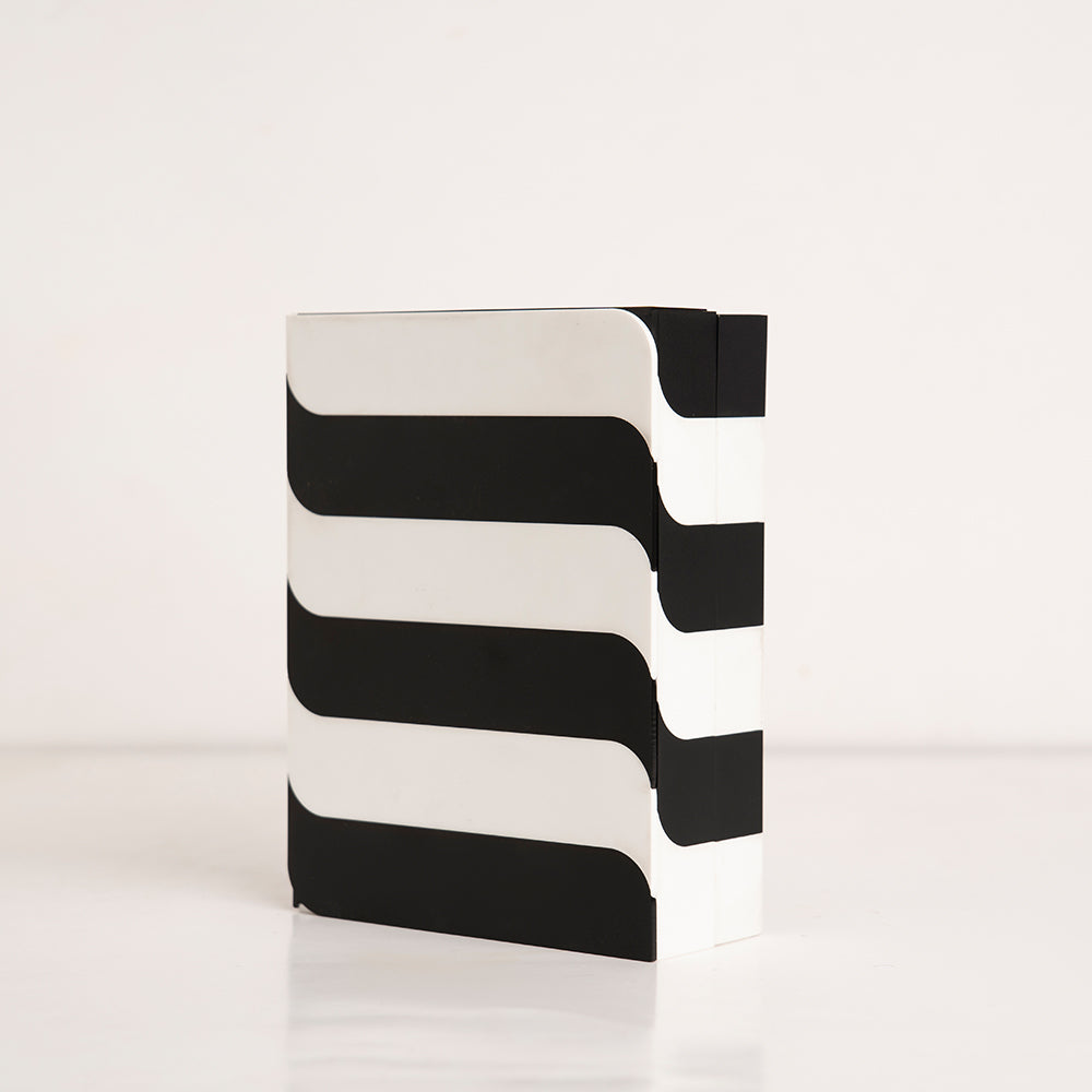 Angled view of modern black and white horizontal pattern gift box