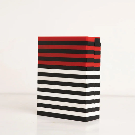 Angled shot of tricolor striped reusable gift box