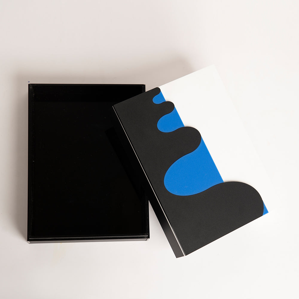 Open top view of layered acrylic box with bold color waves