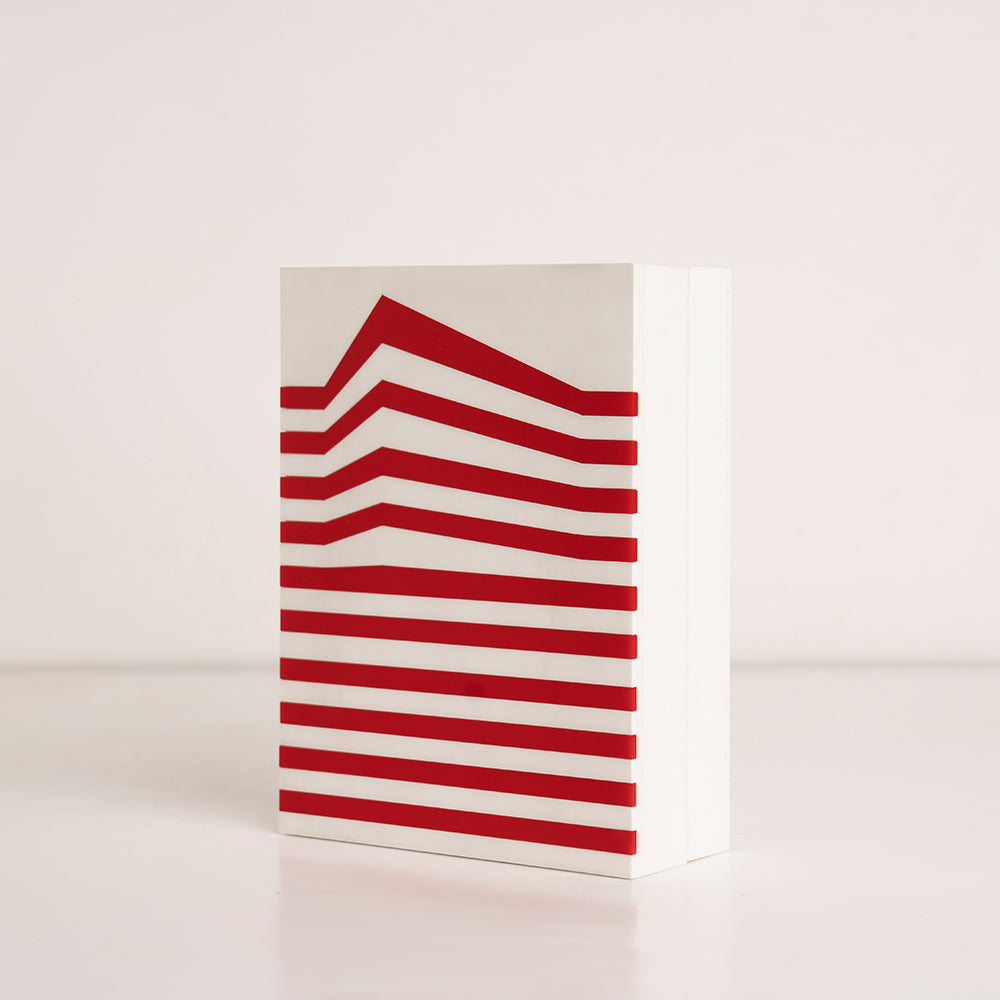 Angled perspective of elegant red and white striped acrylic gift box