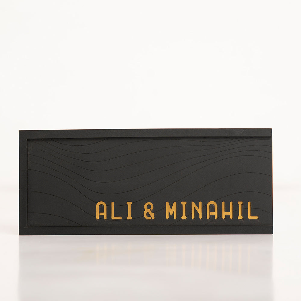 Front of the Black Salami Gift Box with elegant gold writing on matte black finish