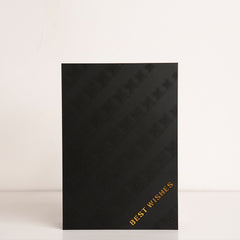 Front view of clear acrylic box with “Best Wishes” engraving