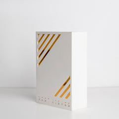 Angled view showing elegant gold accents on white box
