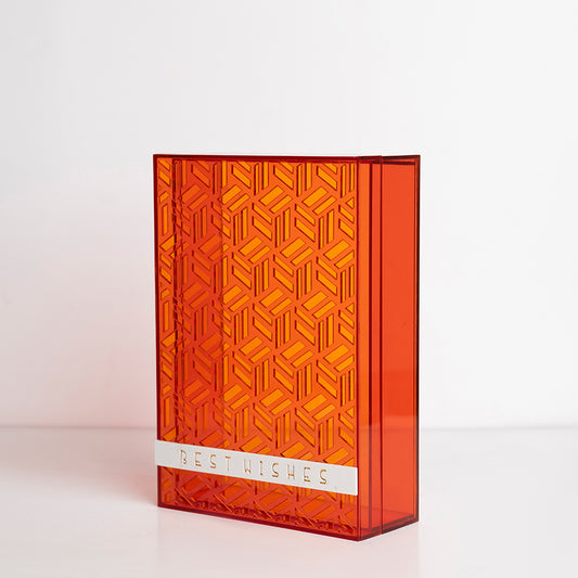 Angled view showing the bold orange color and elegant finish