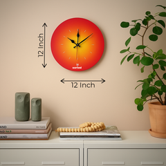 Wall clock with dimensions on a beige wall with decor items below.