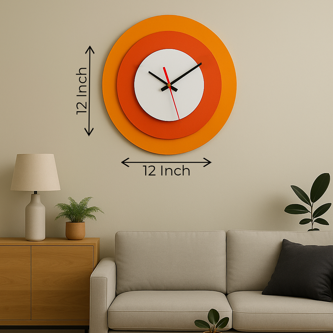 Wall clock with orange and white design on a beige wall above a sofa.