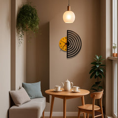 Small dining area with a round wooden table, chairs, and decorative clock on the wall.